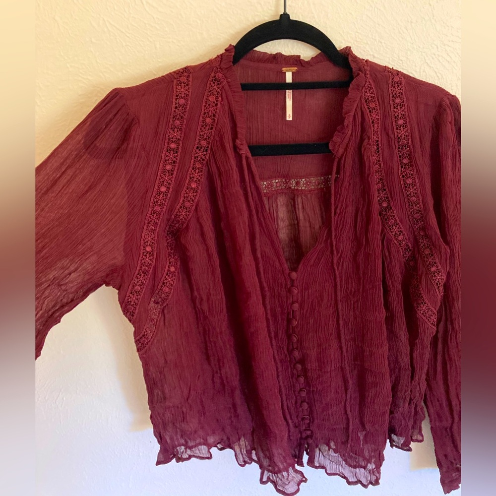 Beautiful, sheer piece from Free People with detailed embroidery and buttons.